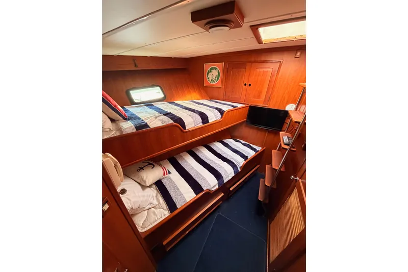 All The Way Yacht Photos Pics Interior of 1984 Hartman-Palmer 60 Flush Deck Motor Yacht with twin bunk beds.