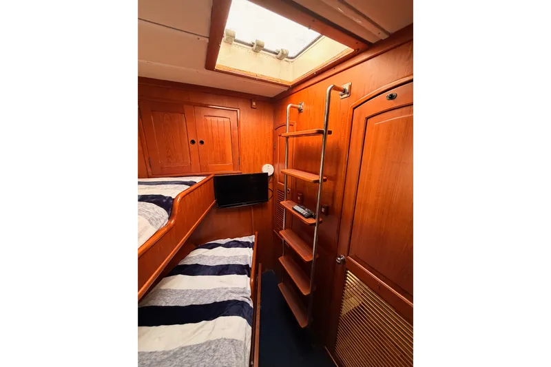 All The Way Yacht Photos Pics Interior of 1984 Hartman-Palmer 60 Flush Deck Motor Yacht with wooden bunk beds and ladder.