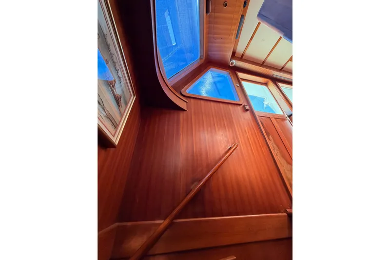 All The Way Yacht Photos Pics Interior view of 1984 Hartman-Palmer 60 Flush Deck Motor Yacht with wooden paneling and windows.