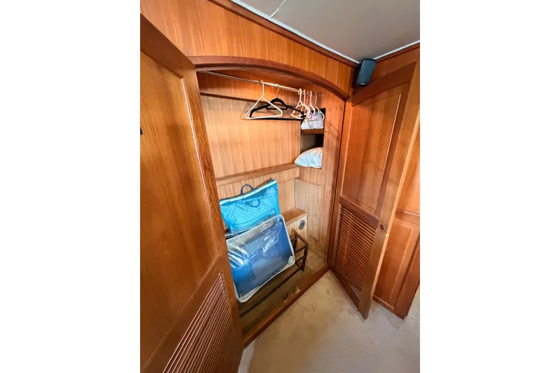 All The Way Yacht Photos Pics Wooden closet interior on 1984 Hartman-Palmer 60 Flush Deck Motor Yacht.