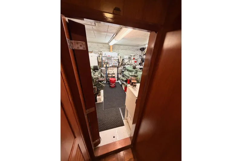 All The Way Yacht Photos Pics Engine room of 1984 Hartman-Palmer 60 Flush Deck Motor Yacht, featuring mechanical equipment.