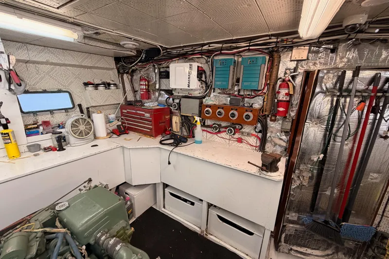 All The Way Yacht Photos Pics Engine room of 1984 Hartman-Palmer 60 Flush Deck Motor Yacht with tools and equipment.