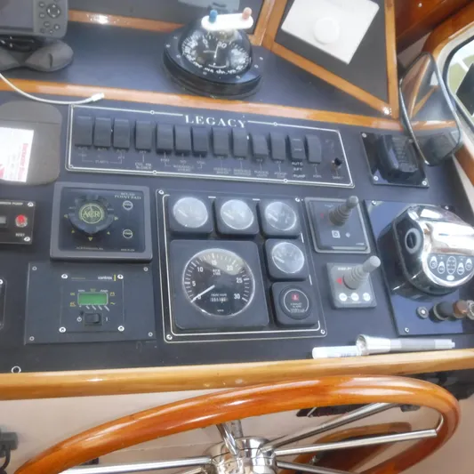Ping Yacht Photos Pics Control panel of a 1998 Legacy 40' Flybridge boat with gauges and switches.