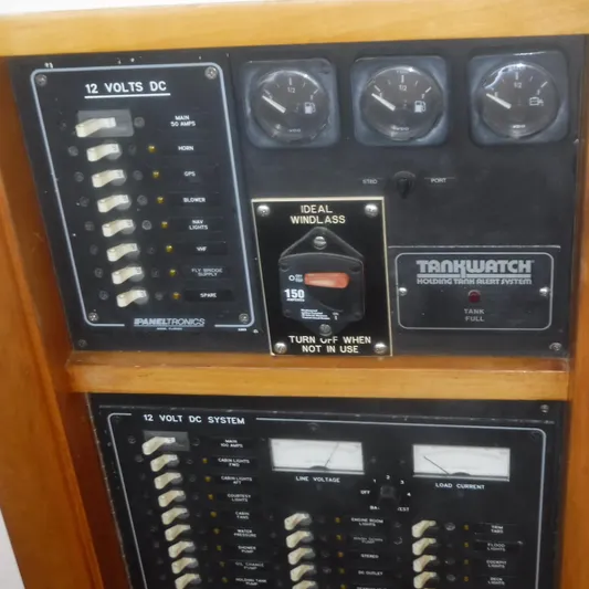 Ping Yacht Photos Pics Electrical panel of 1998 Legacy 40' Flybridge boat, featuring 12V DC system controls.