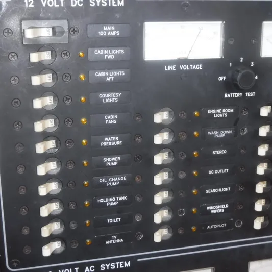 Ping Yacht Photos Pics Legacy 40' Flybridge 1998 electrical panel with switches and voltage meter.