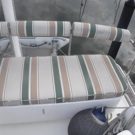 Ping Yacht Photos Pics Striped seating on 1998 Legacy 40' Flybridge yacht deck.