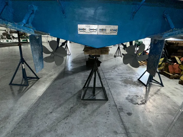  Yacht Photos Pics 2001 Sabreline 43 boat propellers and hull in a maintenance facility.