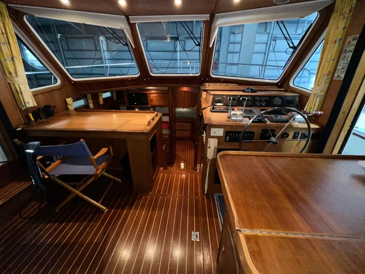  Yacht Photos Pics Interior of 2001 Sabre Sabreline 43 yacht with wooden helm and seating area.