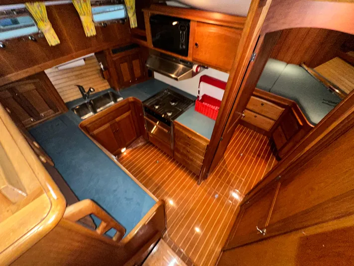  Yacht Photos Pics Interior of 2001 Sabreline 43 yacht with wood finish and modern kitchen amenities.