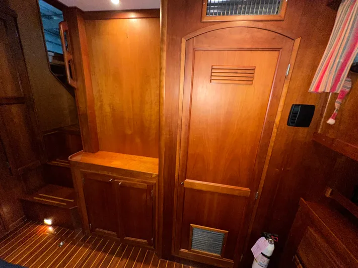  Yacht Photos Pics Interior of 2001 Sabreline 43 yacht with wooden cabinetry and flooring.