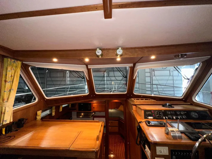  Yacht Photos Pics Interior of 2001 Sabre Sabreline 43 yacht with wooden finishes and navigation controls.