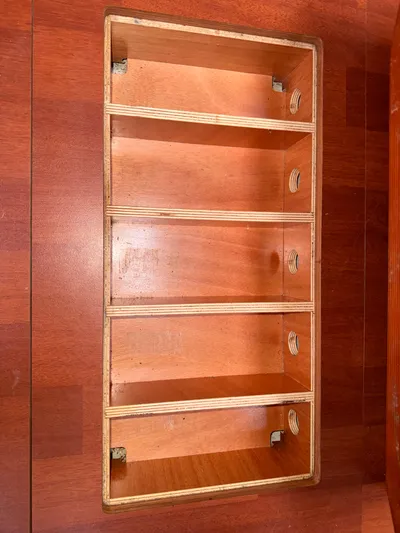 Wildflower III Yacht Photos Pics Wooden storage compartment on a 2016 Beneteau Oceanis 45 sailboat interior.