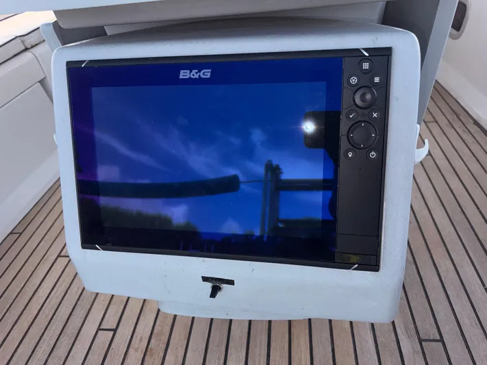 Wildflower III Yacht Photos Pics B&G navigation display on 2016 Beneteau Oceanis 45 yacht, wooden deck background.