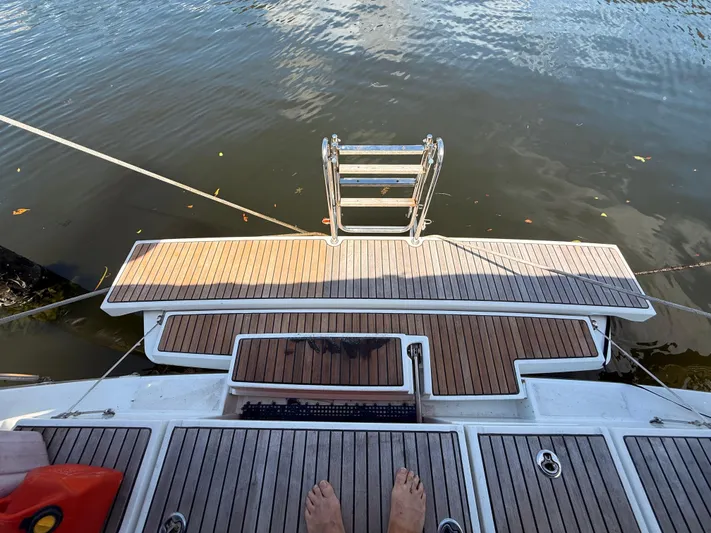 Wildflower III Yacht Photos Pics Beneteau Oceanis 45 yacht stern with teak deck and swim ladder, 2016 model.