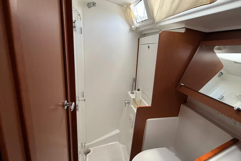 Wildflower III Yacht Photos Pics Interior of 2016 Beneteau Oceanis 45 yacht bathroom with wood accents and modern fixtures.