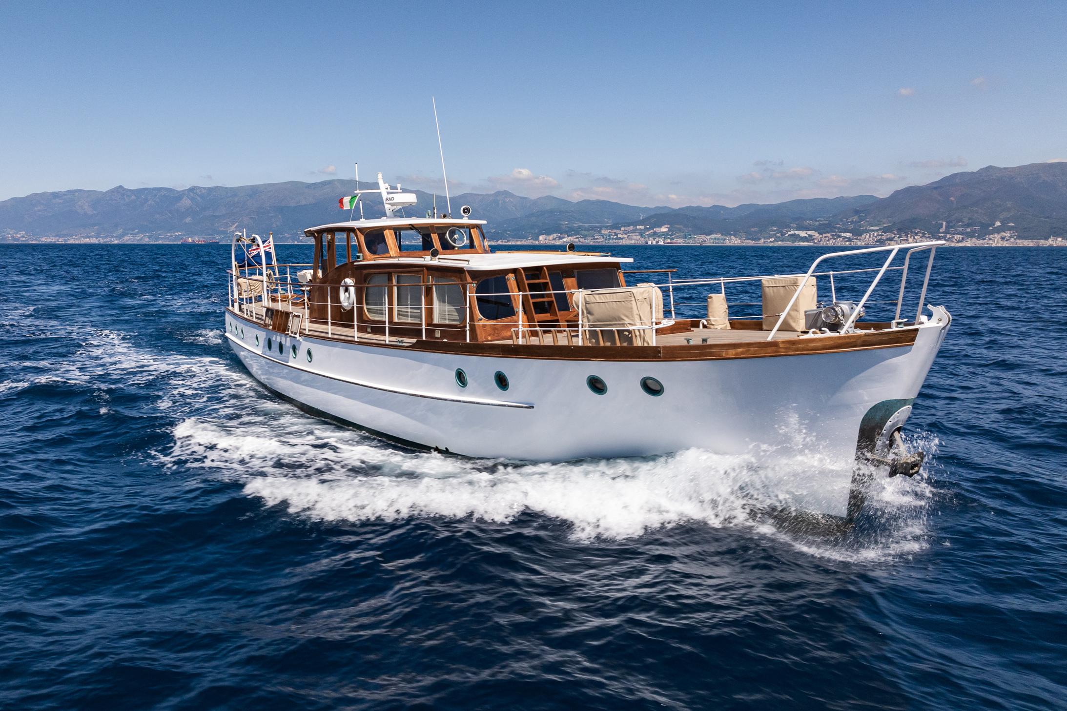 1961 Silver James A Silver yacht cruising on open water.