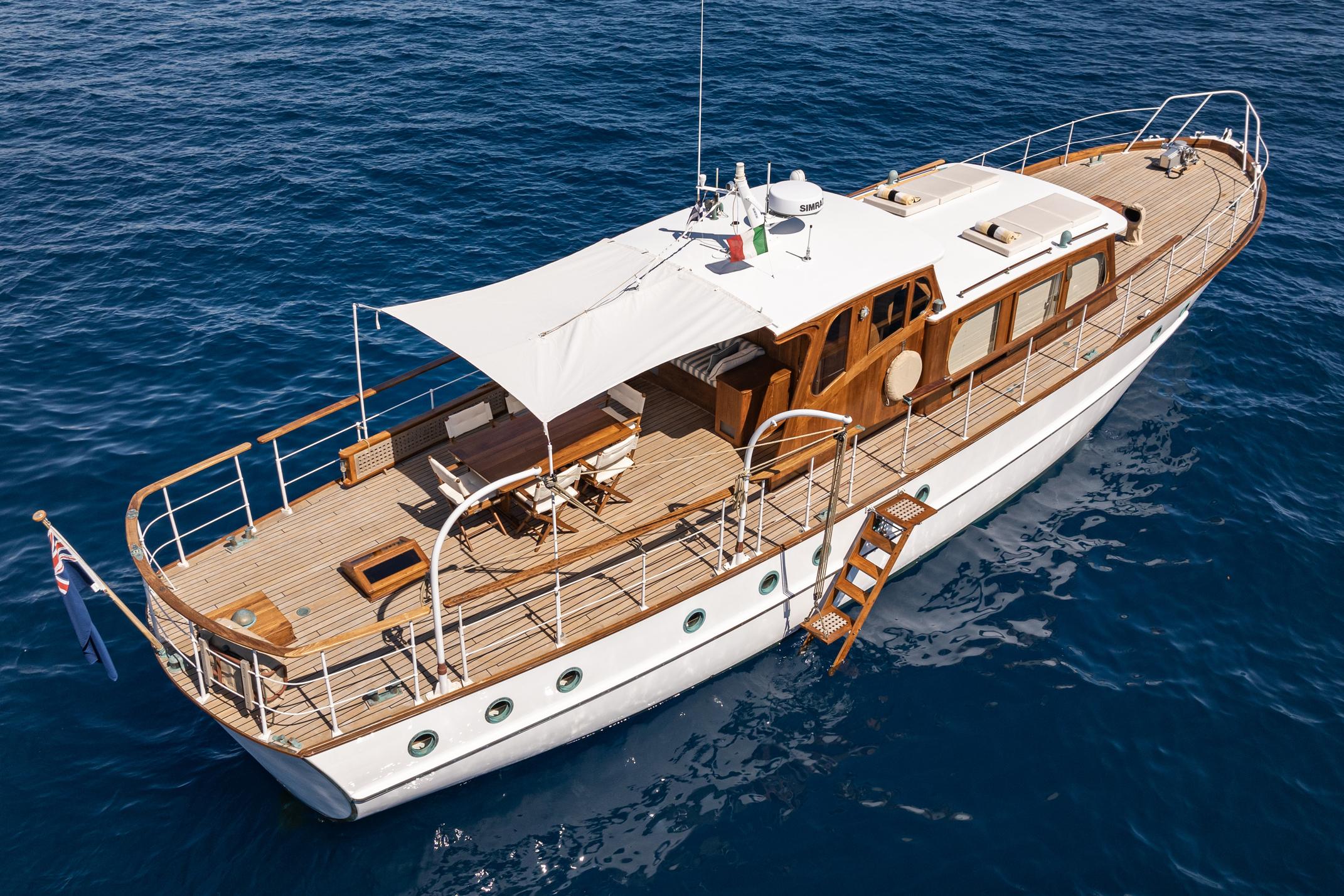1961 James A Silver yacht on open sea, aerial view.