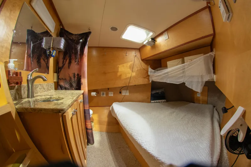 Harborviewbayview Yacht Photos Pics Cozy cabin interior of a 1993 Custom Steel Trawler with bed and sink.