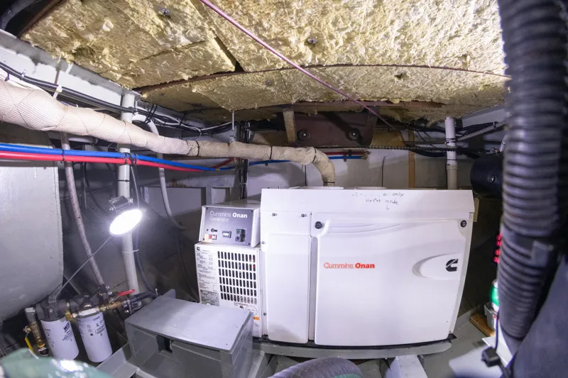 Harborviewbayview Yacht Photos Pics Engine room of a 1993 Custom Steel Trawler with Cummins Onan generator.