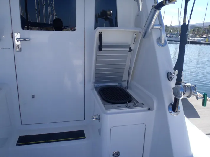 Great White Yacht Photos Pics 2001 Cabo Flybridge boat with outdoor grill and sleek white design.