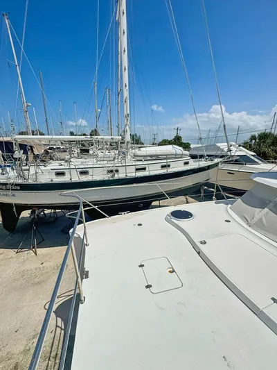 Knot Stupid Yacht Photos Pics 2005 Fountaine Pajot HIGHLAND yacht docked in a marina under a clear blue sky.