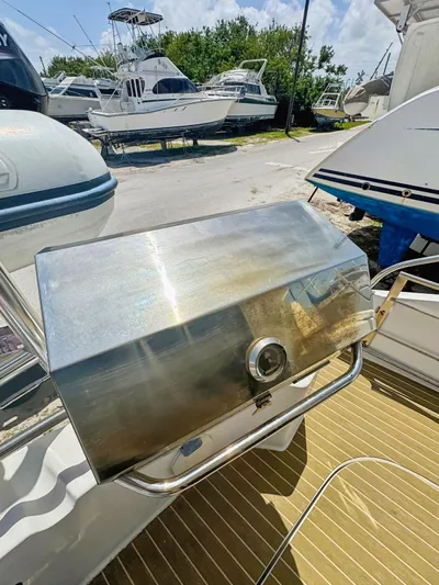 Knot Stupid Yacht Photos Pics Stainless steel grill on 2005 Fountaine Pajot HIGHLAND yacht deck, surrounded by boats.