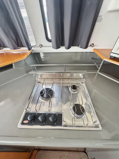 Knot Stupid Yacht Photos Pics 2005 Fountaine Pajot HIGHLAND yacht kitchen with a modern stainless steel stove.