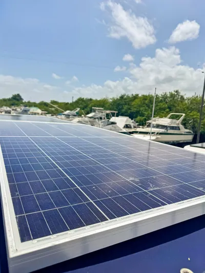 Knot Stupid Yacht Photos Pics Solar panel on 2005 Fountaine Pajot HIGHLAND boat under clear sky.