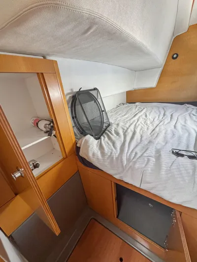 Knot Stupid Yacht Photos Pics 2005 Fountaine Pajot HIGHLAND cabin interior with bed and storage.