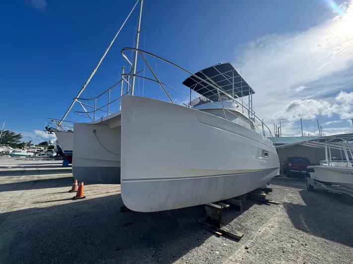 Knot Stupid Yacht Photos Pics 2005 Fountaine Pajot HIGHLAND catamaran on dry dock under clear blue sky.