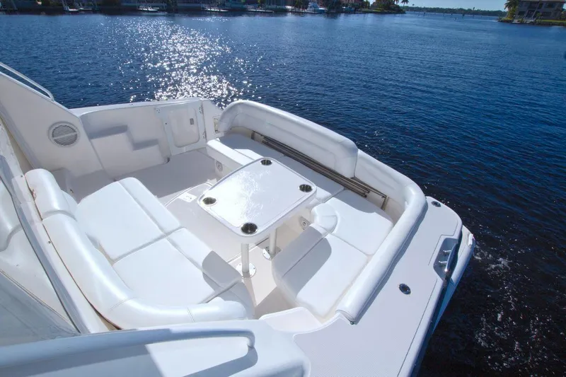 The Adventure Yacht Photos Pics 2008 Tiara Yachts 4300 Sovran, spacious deck with seating, on calm water.