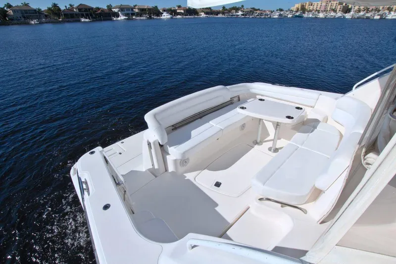 The Adventure Yacht Photos Pics 2008 Tiara Yachts 4300 Sovran, spacious deck overlooking serene waterfront.