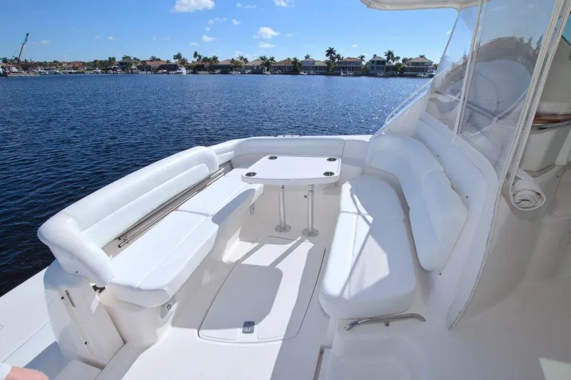 The Adventure Yacht Photos Pics 2008 Tiara Yachts 4300 Sovran with spacious white seating and table on deck.