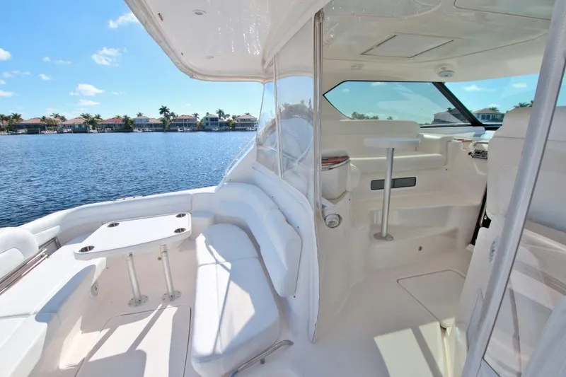 The Adventure Yacht Photos Pics 2008 Tiara Yachts 4300 Sovran interior with seating, table, and water view.