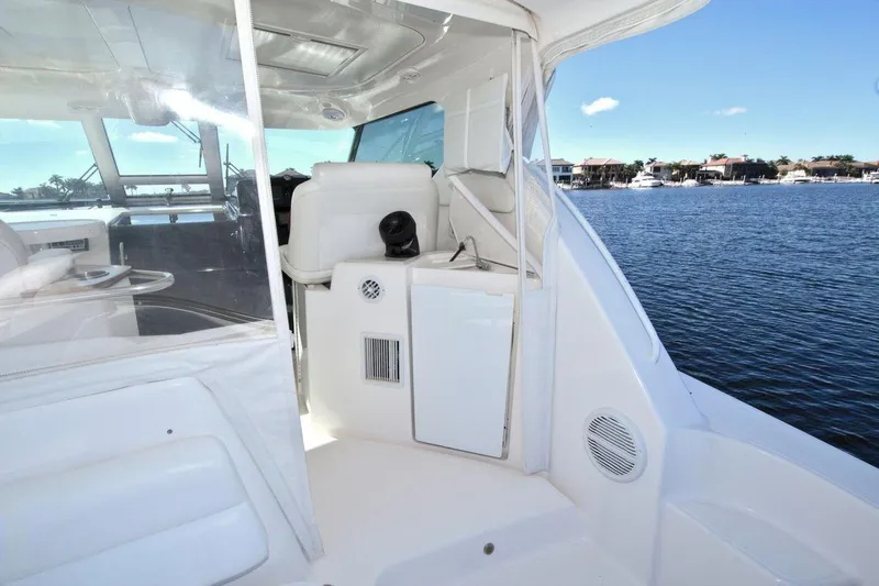 The Adventure Yacht Photos Pics 2008 Tiara Yachts 4300 Sovran interior with white seating and water view.