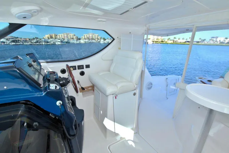 The Adventure Yacht Photos Pics 2008 Tiara Yachts 4300 Sovran interior with helm and waterfront view.