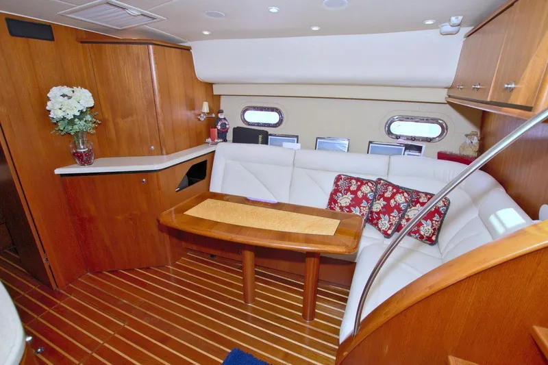 The Adventure Yacht Photos Pics Luxurious interior of 2008 Tiara Yachts 4300 Sovran with elegant wood finish.