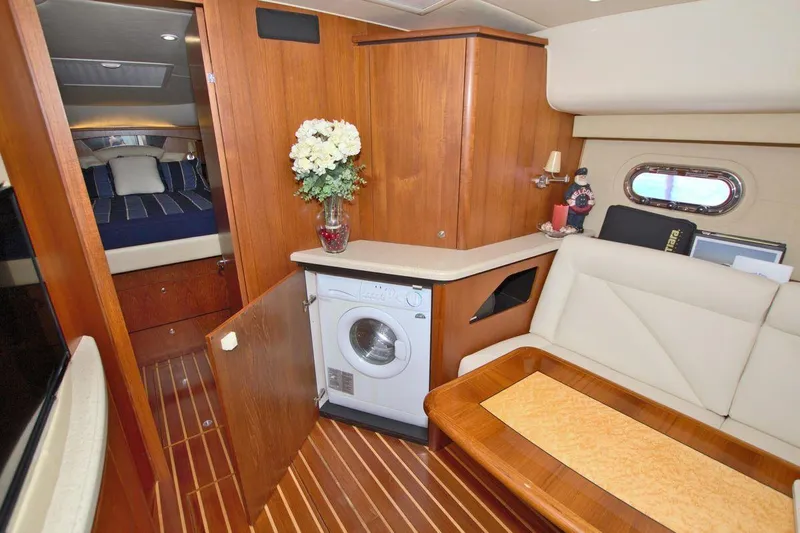 The Adventure Yacht Photos Pics Interior of 2008 Tiara Yachts 4300 Sovran with washer, seating, and wood accents.