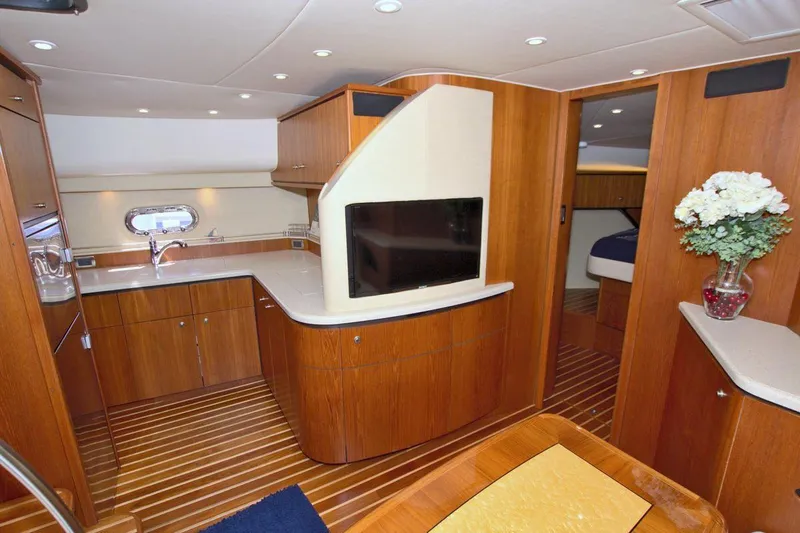 The Adventure Yacht Photos Pics Interior of 2008 Tiara Yachts 4300 Sovran with modern wood finish and sleek design.