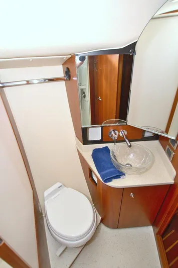 The Adventure Yacht Photos Pics 2008 Tiara Yachts 4300 Sovran bathroom with modern fixtures and elegant design.