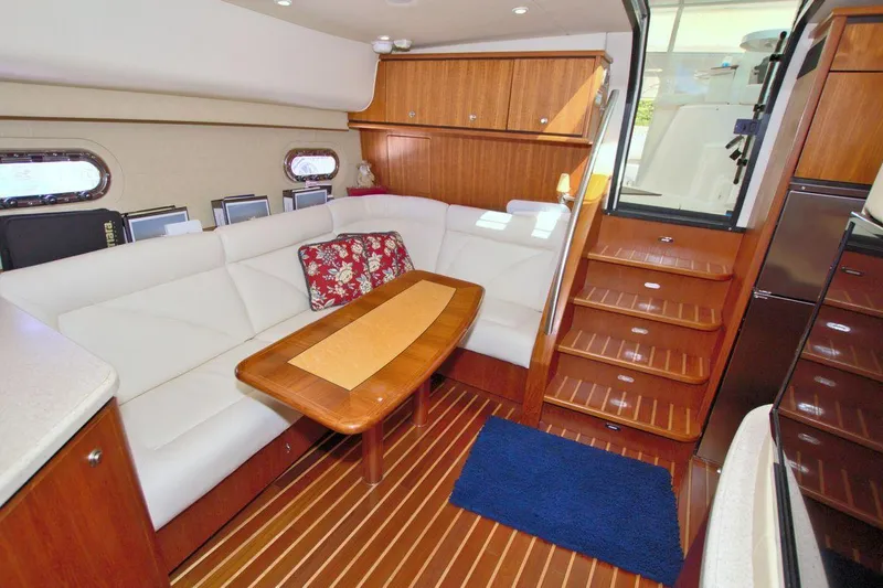 The Adventure Yacht Photos Pics Interior of 2008 Tiara Yachts 4300 Sovran with elegant seating and wooden finishes.