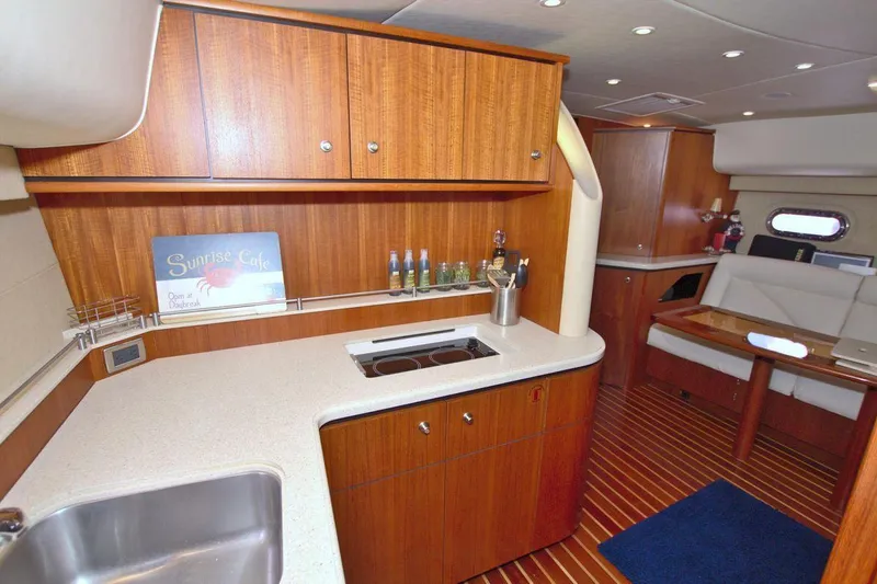 The Adventure Yacht Photos Pics Interior of 2008 Tiara Yachts 4300 Sovran, featuring a modern kitchen and seating area.