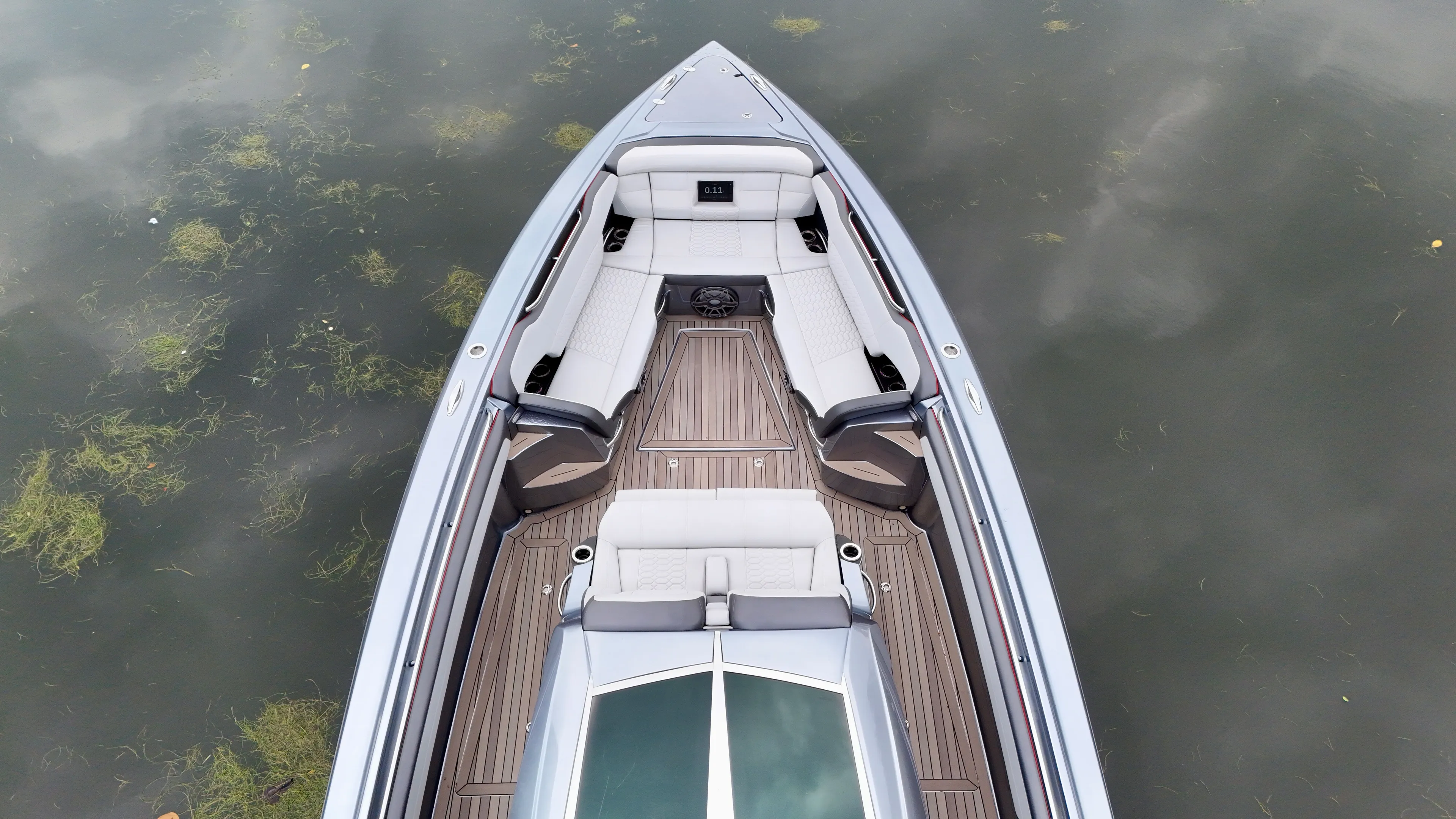  Yacht Photos Pics Top view of 2022 Nor-Tech 50 Sport boat with sleek seating and wooden deck.