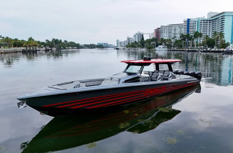  Yacht Photos Pics 2022 Nor-Tech 50 Sport boat on calm water, cityscape background.