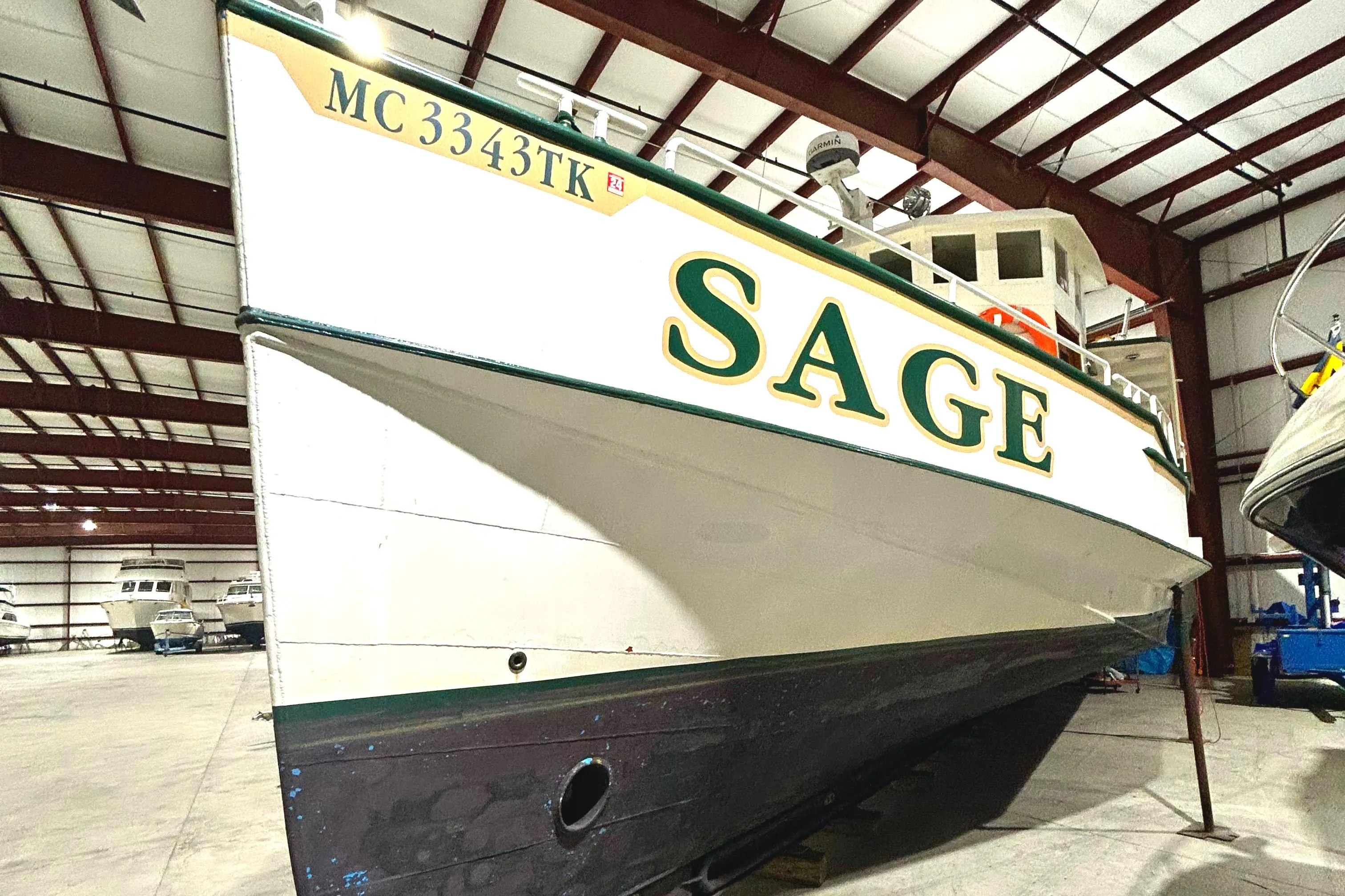 Custom 1993 Steel Trawler "SAGE" in indoor storage facility.