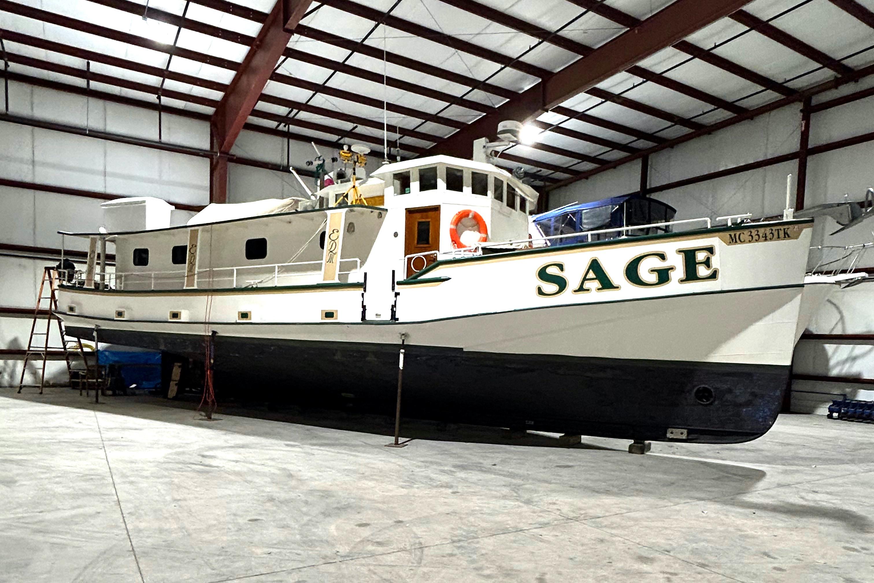 Custom 1993 Steel Trawler SAGE in a warehouse, side view.