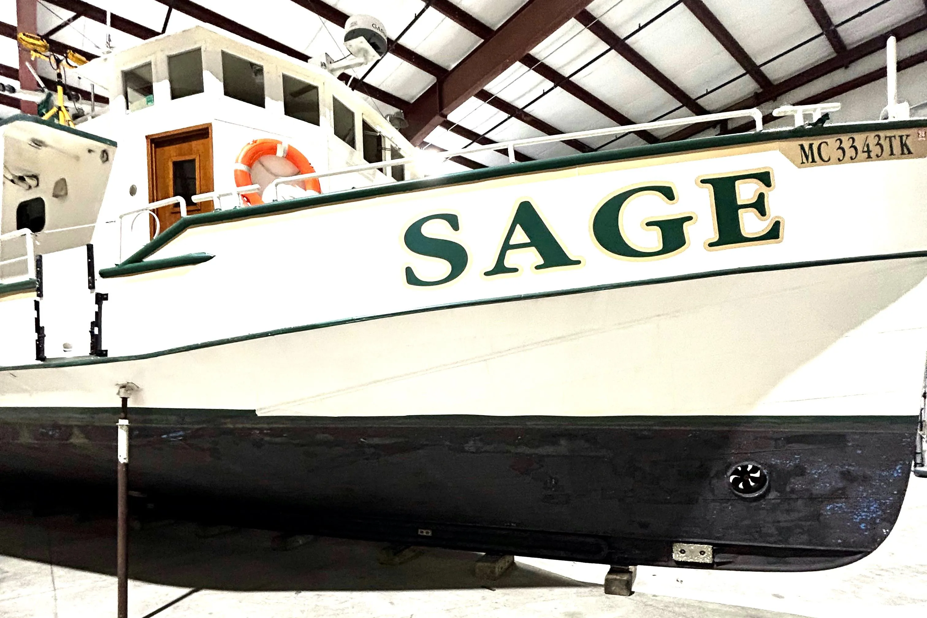 Custom 1993 Steel Trawler SAGE in dry dock, side view.