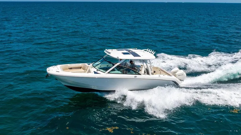  Yacht Photos Pics 2019 Boston Whaler 320 Vantage cruising on open ocean waters.