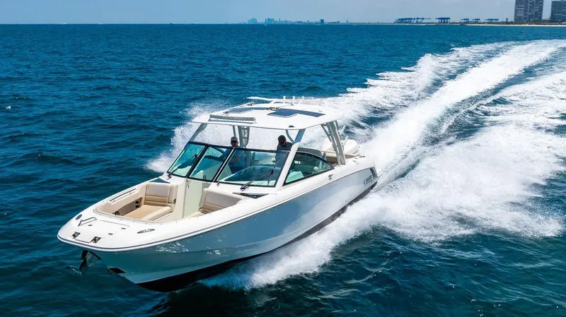  Yacht Photos Pics 2019 Boston Whaler 320 Vantage cruising on open blue water.
