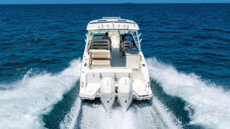  Yacht Photos Pics 2019 Boston Whaler 320 Vantage cruising on open ocean waters.
